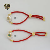 (1-60100) - Pulsera de Animales de Hilo Rojo Bañada en Oro.